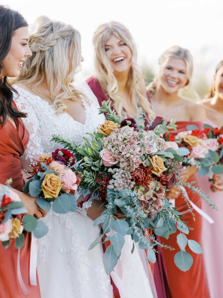 bridal party closeup of bouquets with fall colors