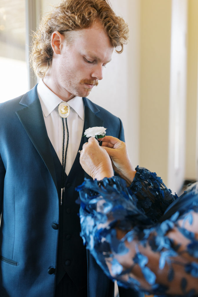 groom photos with boutonniere 